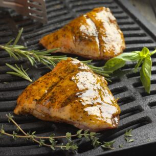 Grilled chicken or fish fillets with fresh rosemary and thyme, marinated to perfection for use with AVO Lafiness Mediterranean Marinade 4kg from Parkers Food Machinery Plus products.