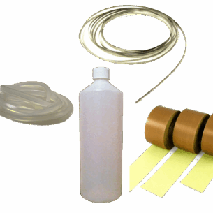 Service kit components including clear plastic bottle, coiled transparent and translucent tubes, and brown adhesive tape rolls. Ideal for maintenance, assembly, or food machinery support