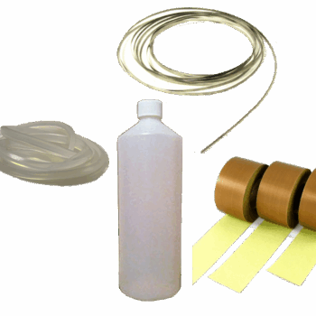 Service kit components including clear plastic bottle, coiled transparent and translucent tubes, and brown adhesive tape rolls. Ideal for maintenance, assembly, or food machinery support