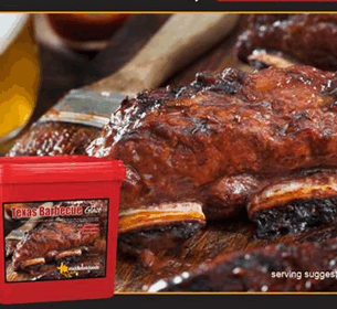 Texas Barbecue Sauce container with serving suggestion of glazed ribs, beer glass, and wooden cutting board in background